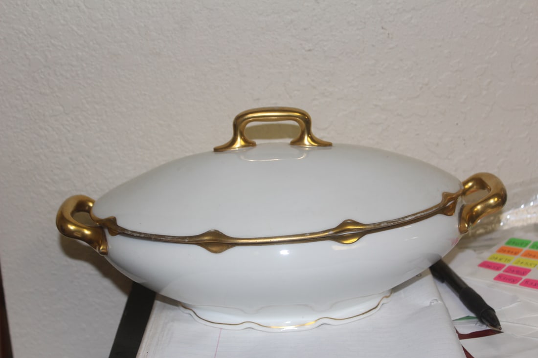 An Austrian Taureen: please note: one chip as shown - handle to handle: 11 3/4" long