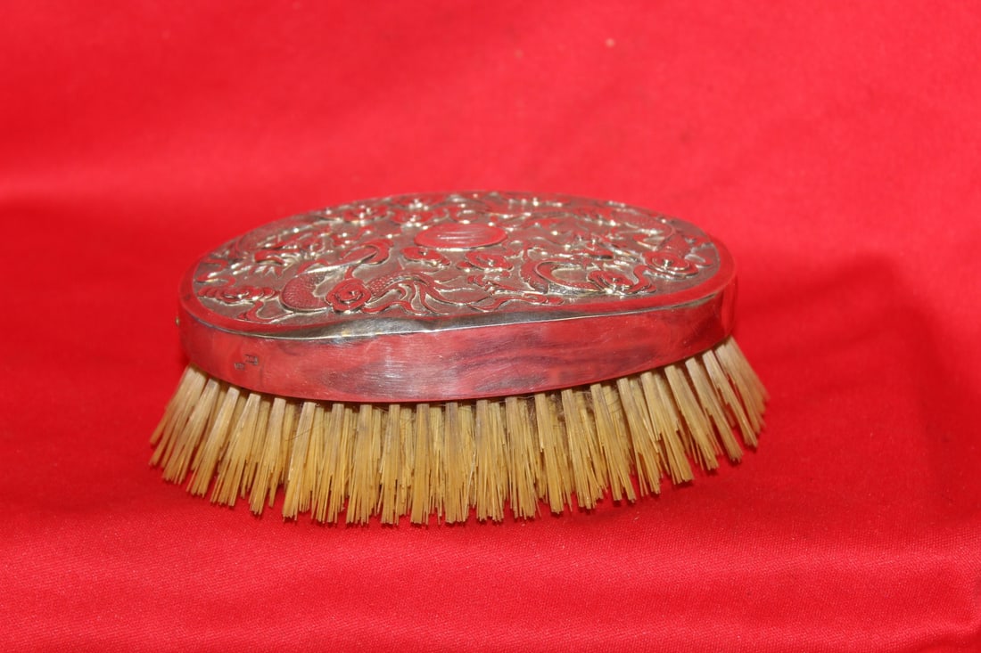 A Chinese Export Silver Dragon Motief Brush: please note: one small dent on the edge - 6 inches long - some markings on the side