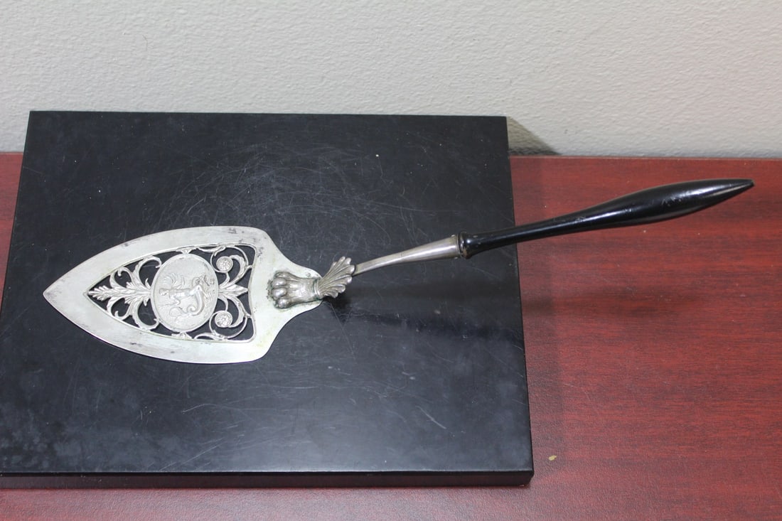 A Sterling and Wood Cake Server: 12 1/2" long straight line measurement