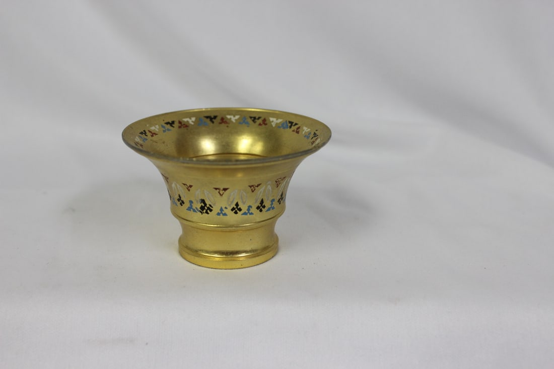 A Metal Cup: 2 5/8" in diameter