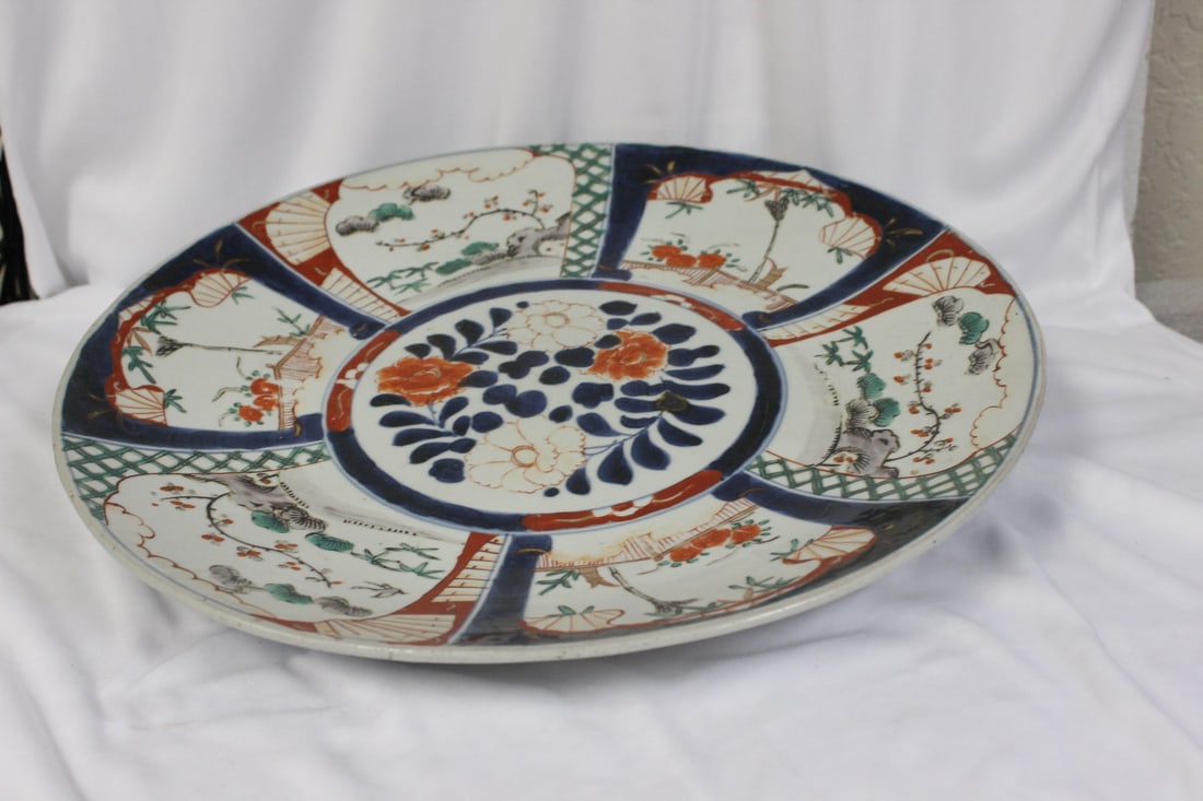 A Japanese Imari Charger: 15 1/2" in diameter - 19th century - please note: underrim chip, possibly due to manufacturer - signed