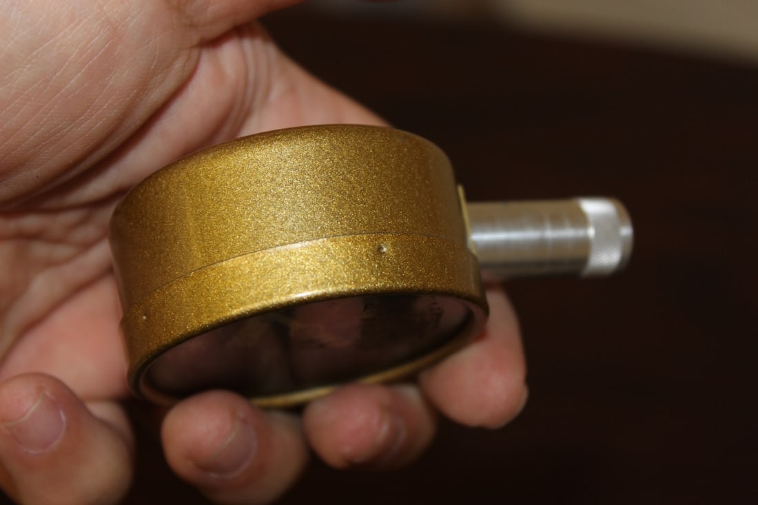 A Brookstone Company Tire Gauge - 3