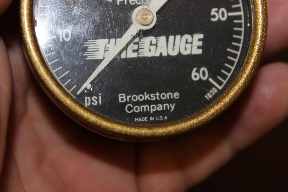 A Brookstone Company Tire Gauge - 6