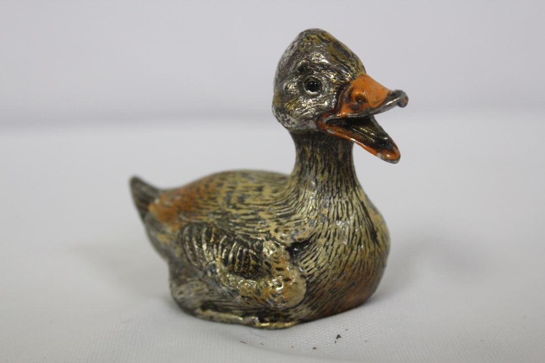 A Polychrome Lead Duck: Marked China - also possibly a makers mark - solid - 2 5/8" long