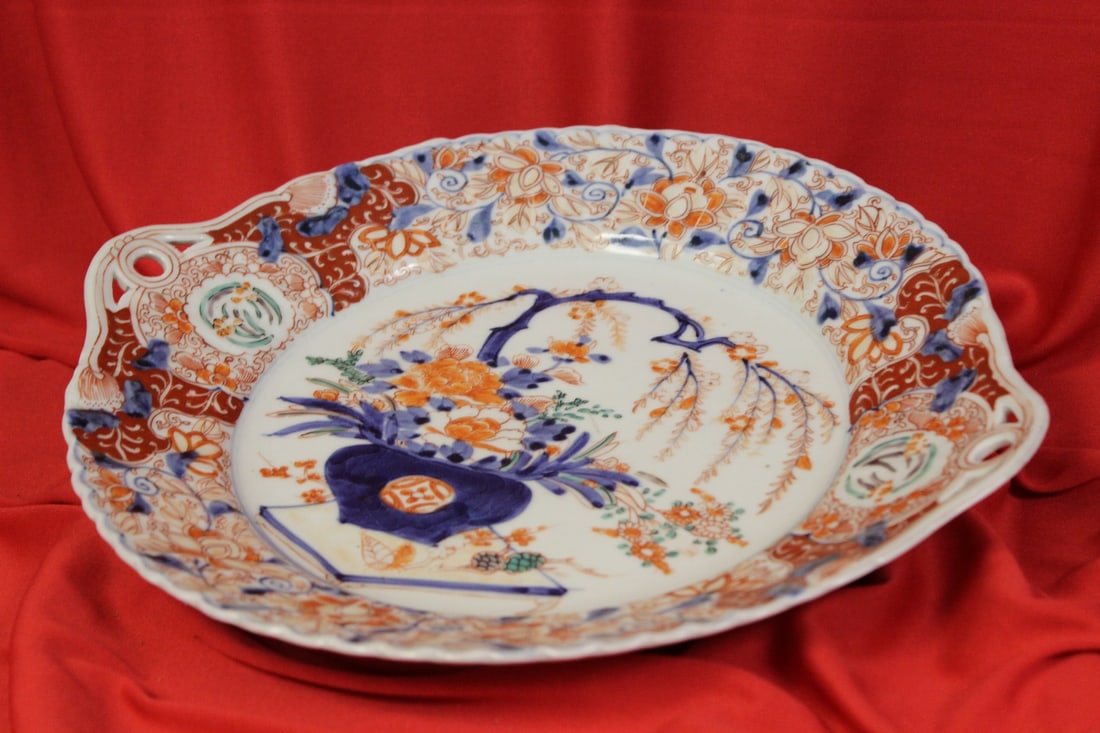 A Japanese Imari Plate: please note: one underchip as shown - measures 12 3/4" from handle to handle