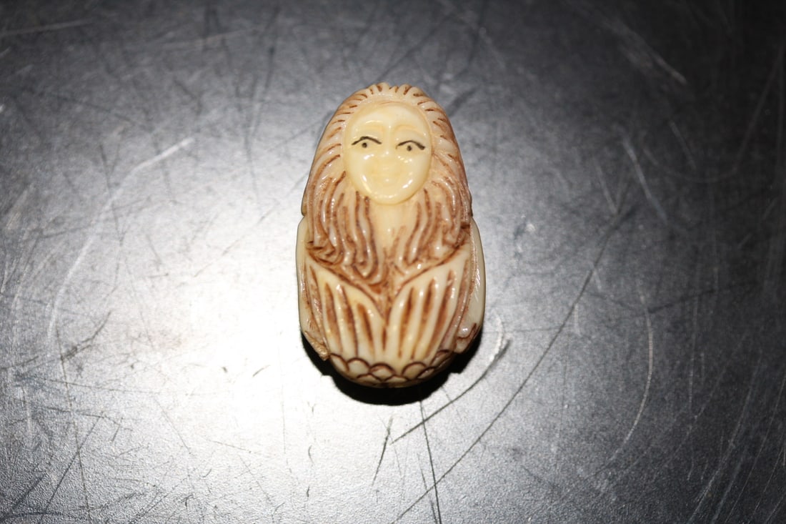 A Well Carved Small Bone Bead: as shown