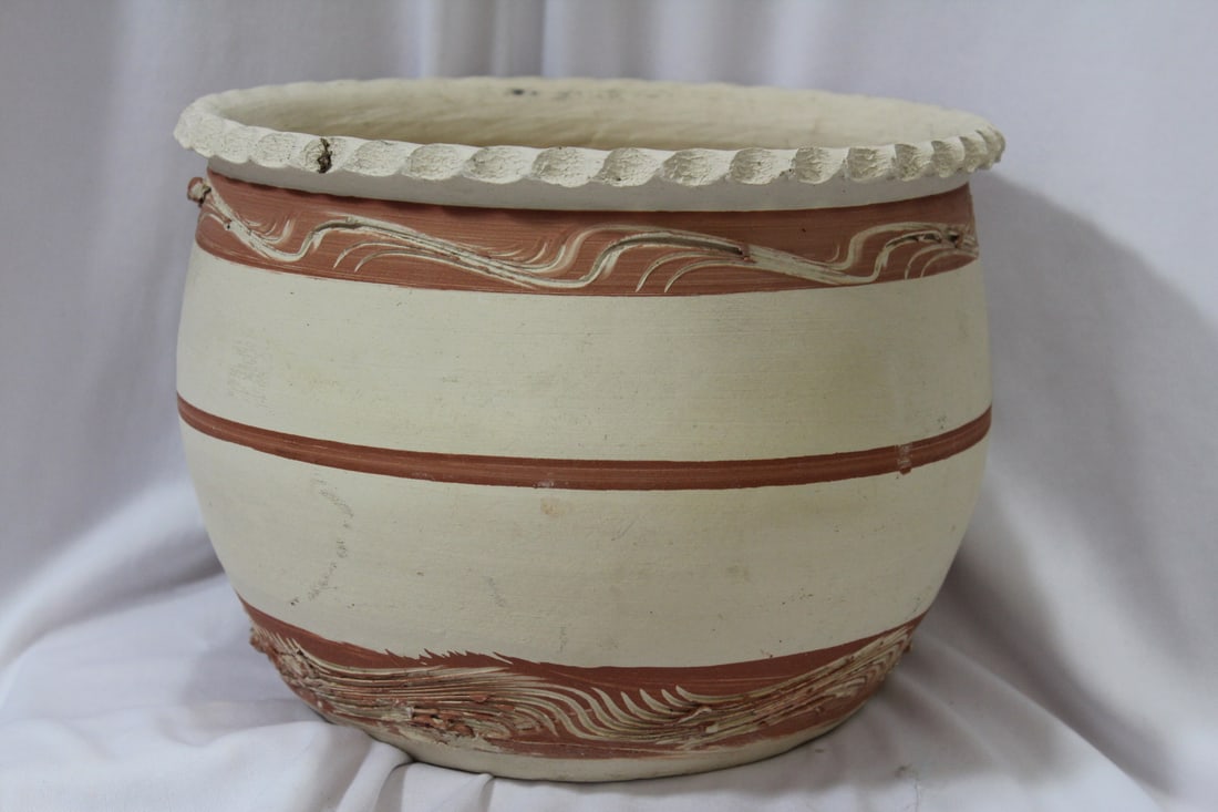 A Flower Pot: 6 1/2" tall x 8 5/8" in diameter