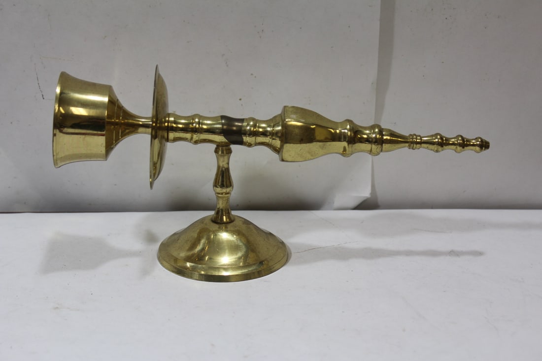 A Single Wall Mount Brass Candle Holder: 10 1/2" across