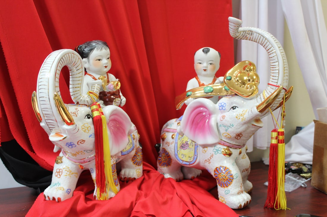 A Boy and Girl on Elephant Statues: trunks up - oriental, most likely Chinese - taller= 14 3/4"