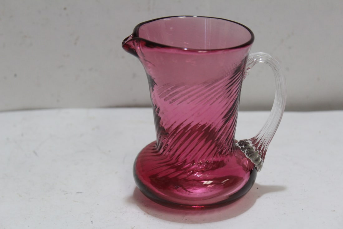 A Small Cranberry Glass Pitcher: 3 3/4" tall