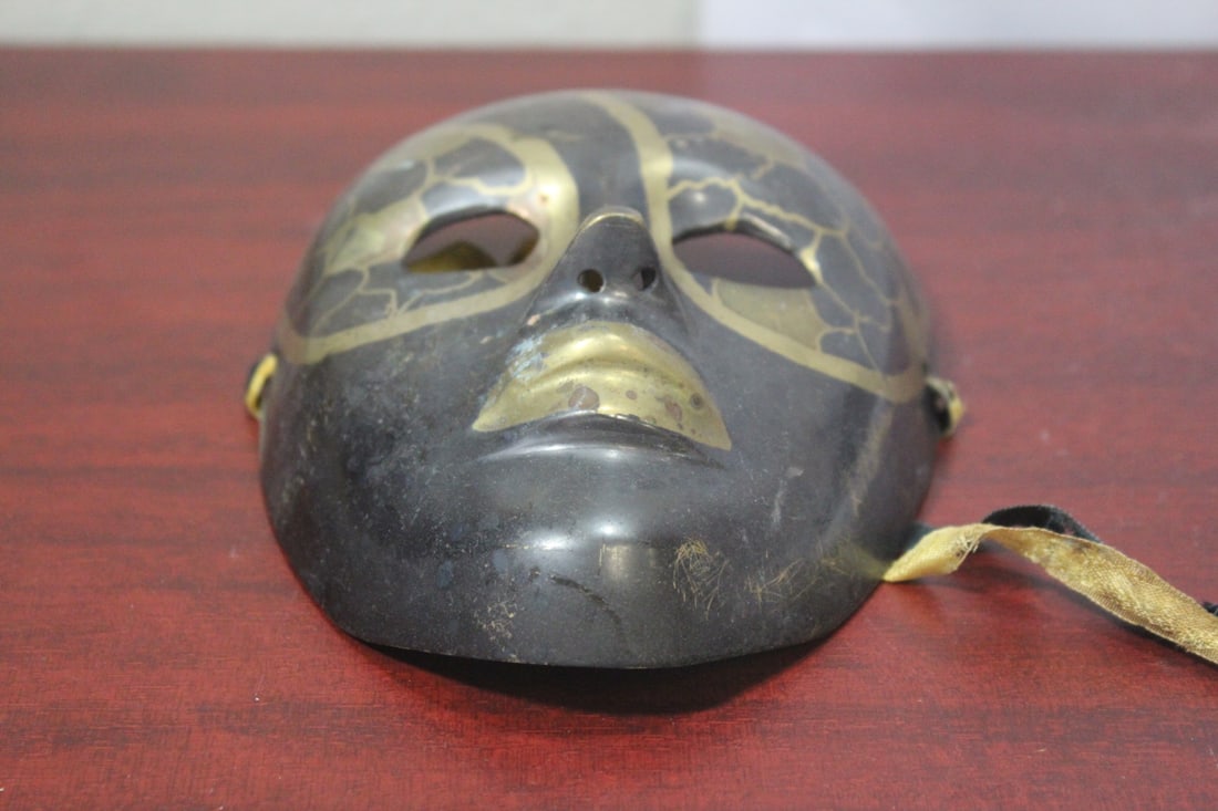 A Metal Mask: 6" across