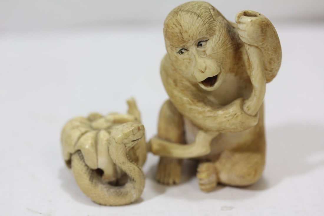 An Intricated Carved Bone Japanese Okimono: unsigned - nicely carved - 2 1/2" tall