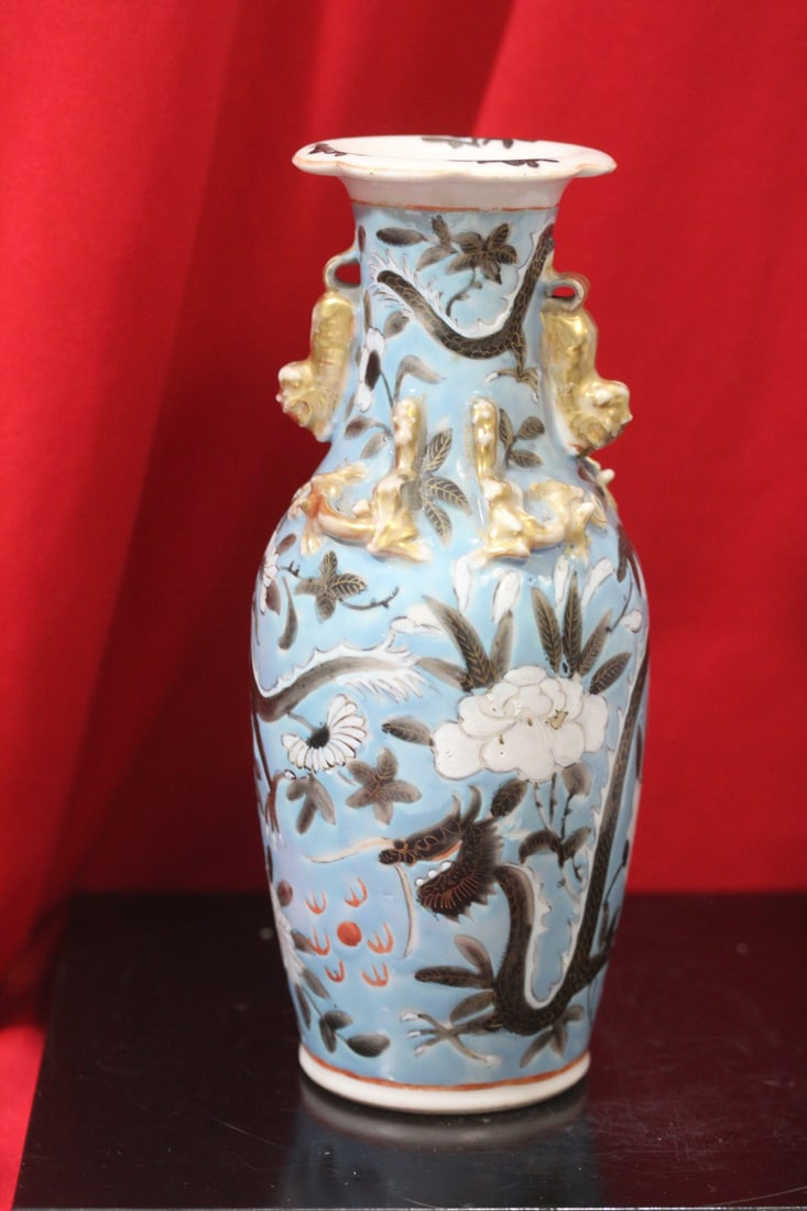 An Antique Chinese Vase: 19th century - please note: possible restoration in the middle as shown - nice dragon design - 8 inches tall