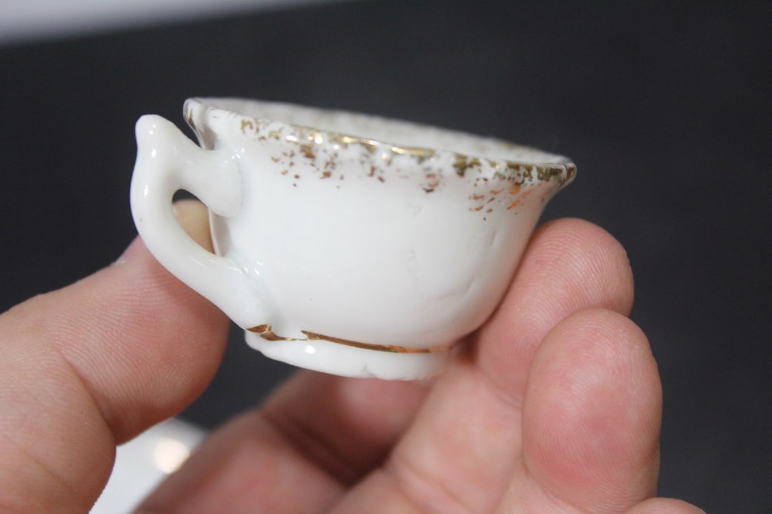 A Miniature Ceramic Cup and Saucer - 4