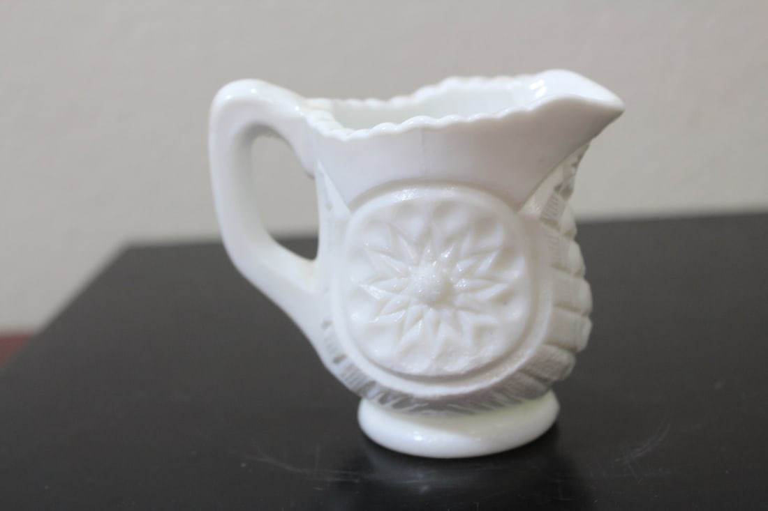 A Small Milk Glass Pitcher: 2 3/4â€ tall
