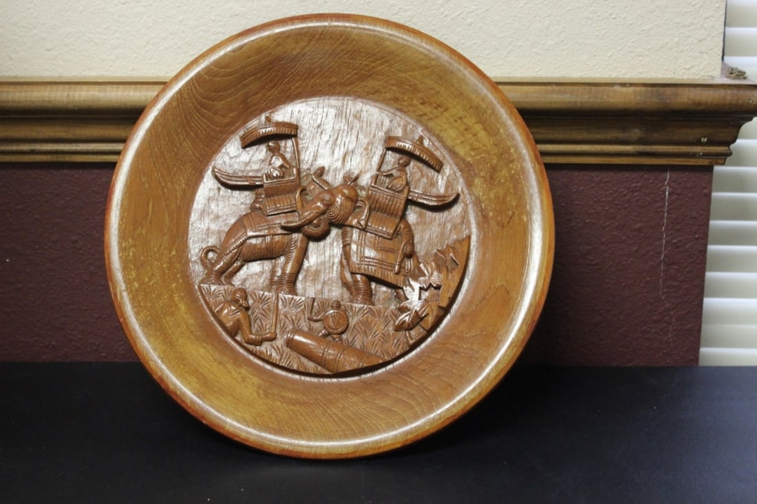 A Carved Wooden Plate: 11 3/4 inches in diameter