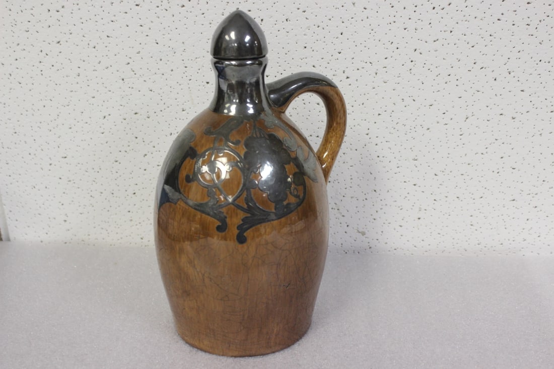 A vintage Sterling Overlay Musical Jug - 2