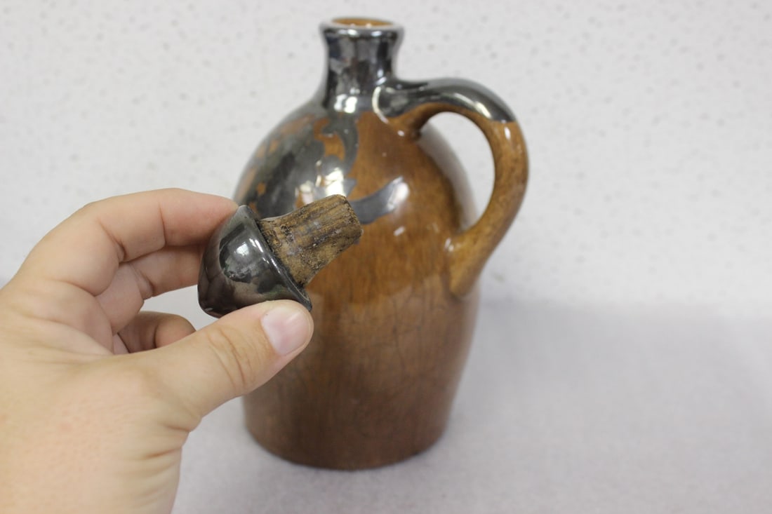 A vintage Sterling Overlay Musical Jug - 3