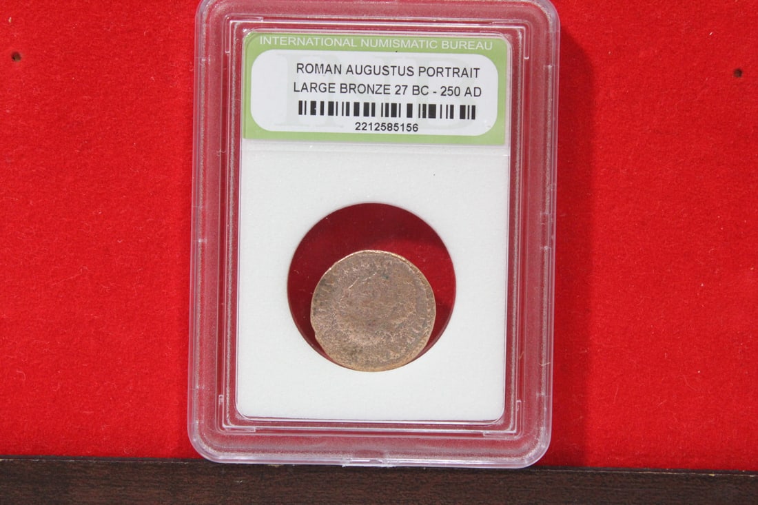A Slabbed Large Bronze Roman Coin: Augustus portrait - 27 B.C. - 250 A.D.