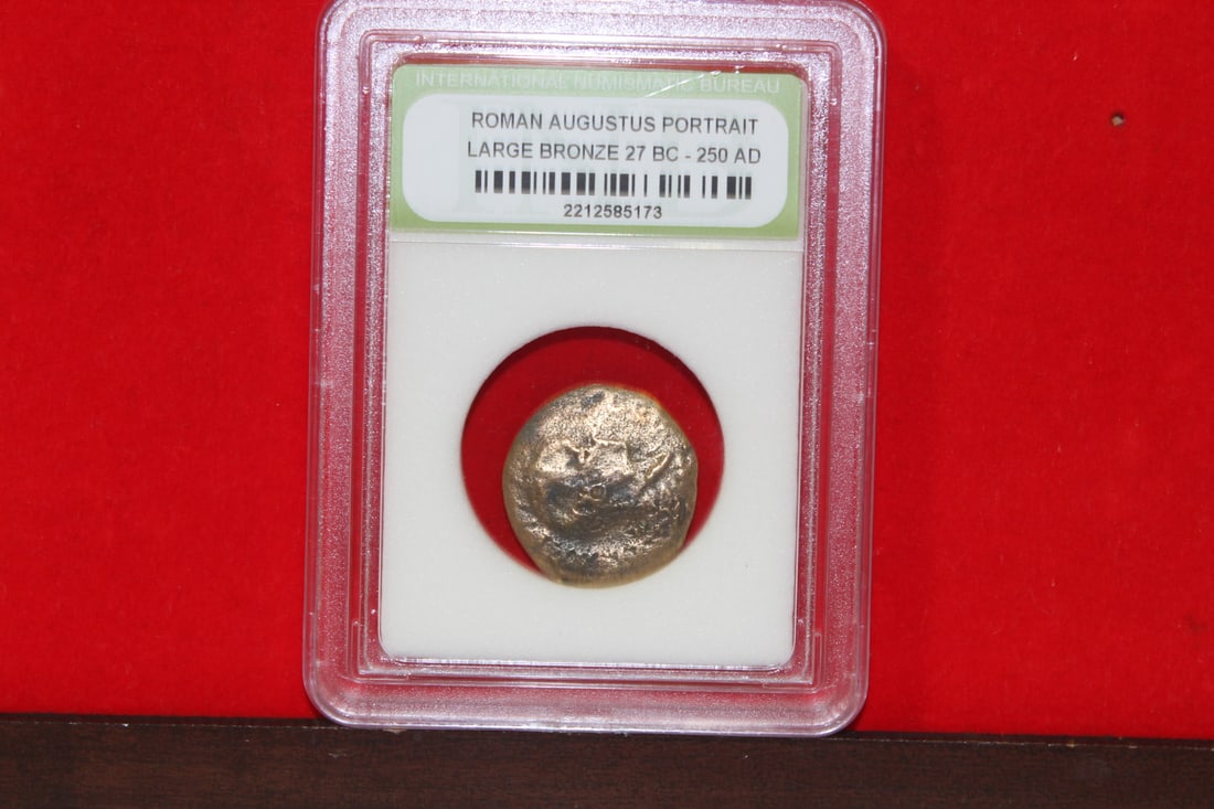 A Slabbed Large Bronze Roman Coin: Augustus portrait - 27 B.C. - 250 A.D.