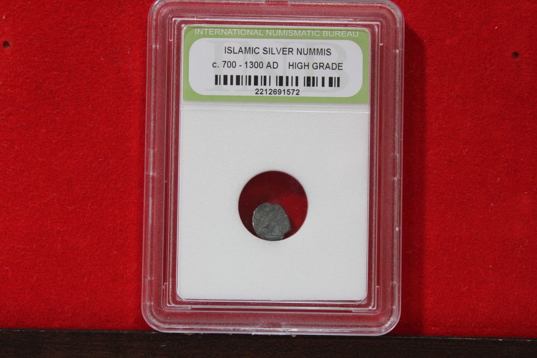 A Slabbed Islamic Silver Nummis: High Grade - c. 700 - 1300 A.D.