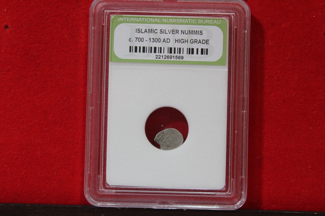 A Slabbed Islamic Silver Nummis: High Grade - c. 700 - 1300 A.D.