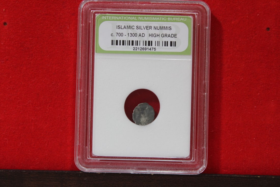 A Slabbed Islamic Silver Nummis: High Grade - c. 700 - 1300 A.D.
