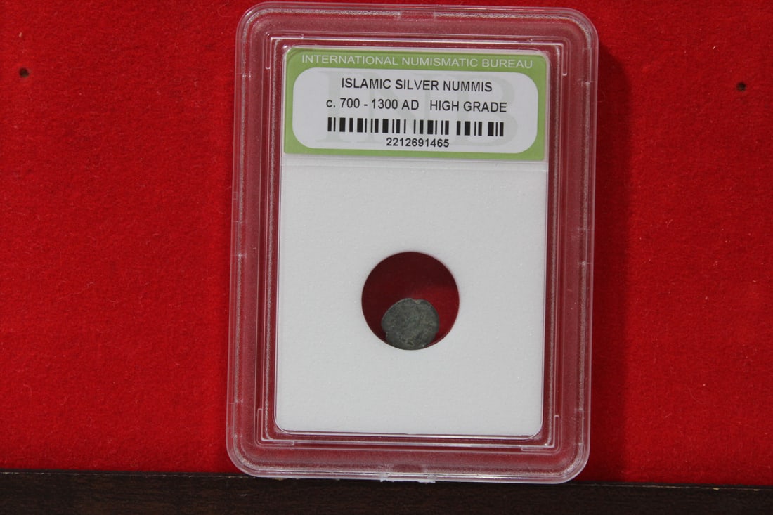 A Slabbed Islamic Silver Nummis: High Grade - c. 700 - 1300 A.D.