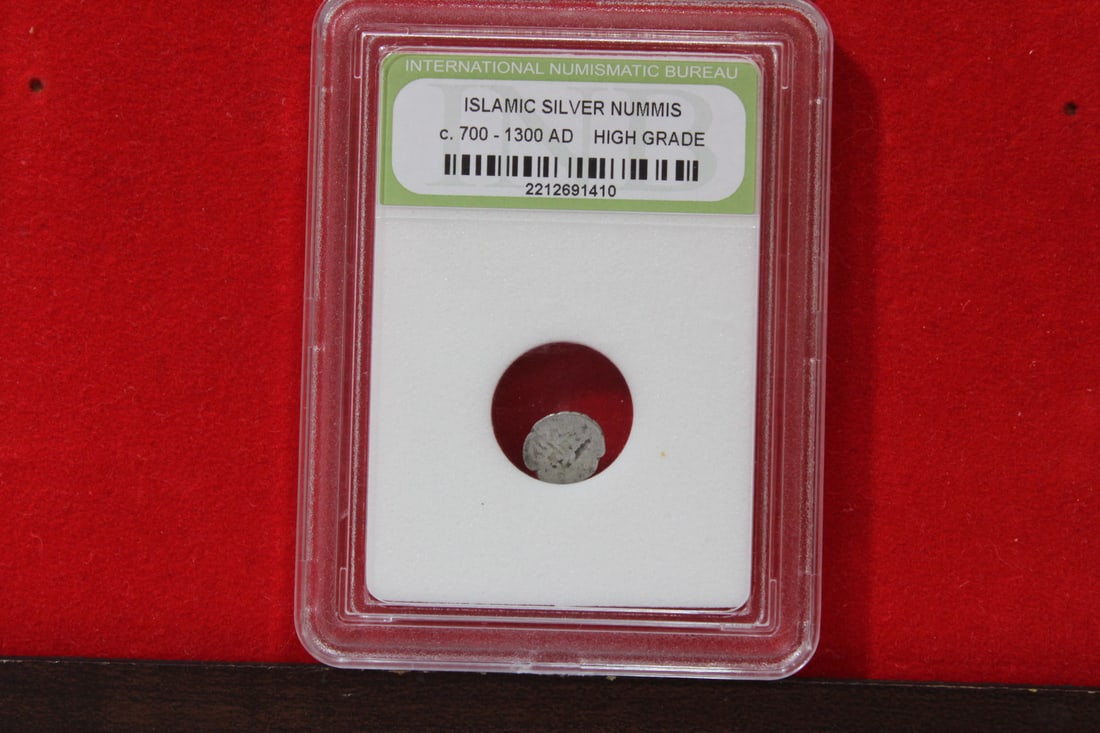 A Slabbed Islamic Silver Nummis: High Grade - c. 700 - 1300 A.D.