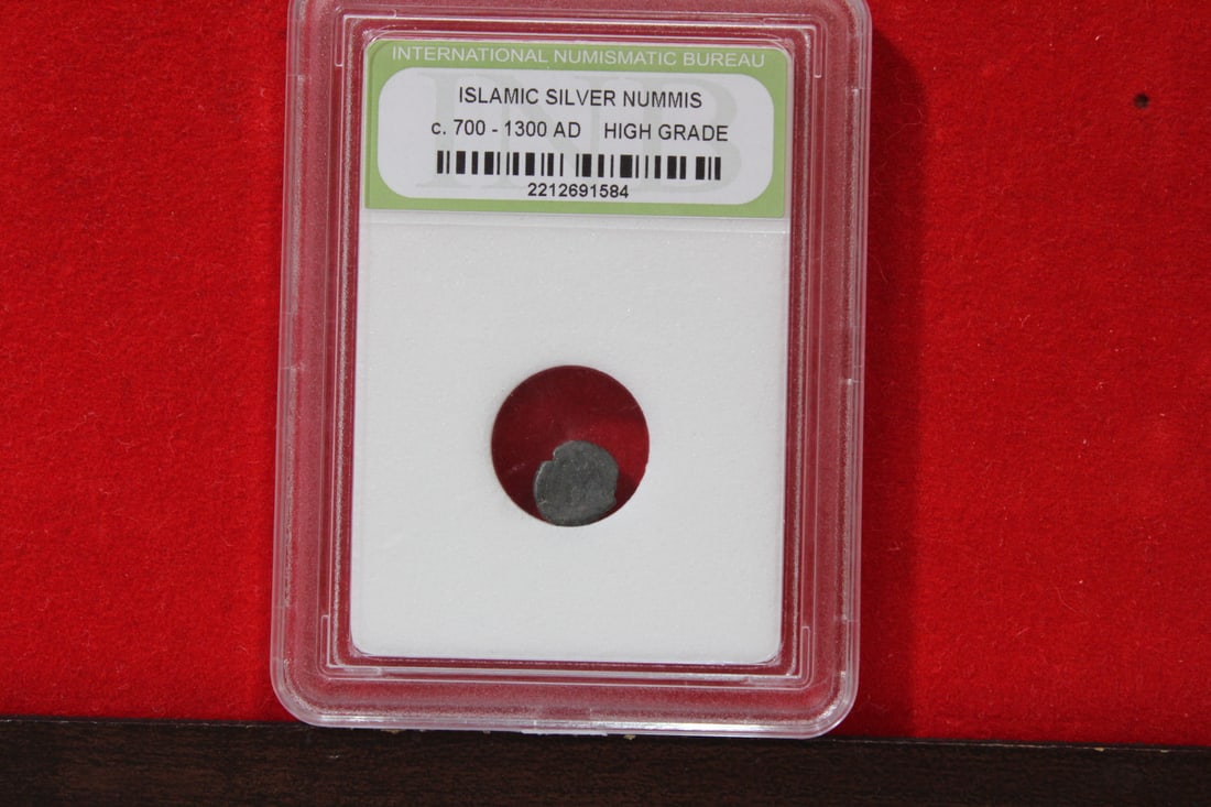 A Slabbed Islamic Silver Nummis: High Grade - c. 700 - 1300 A.D.