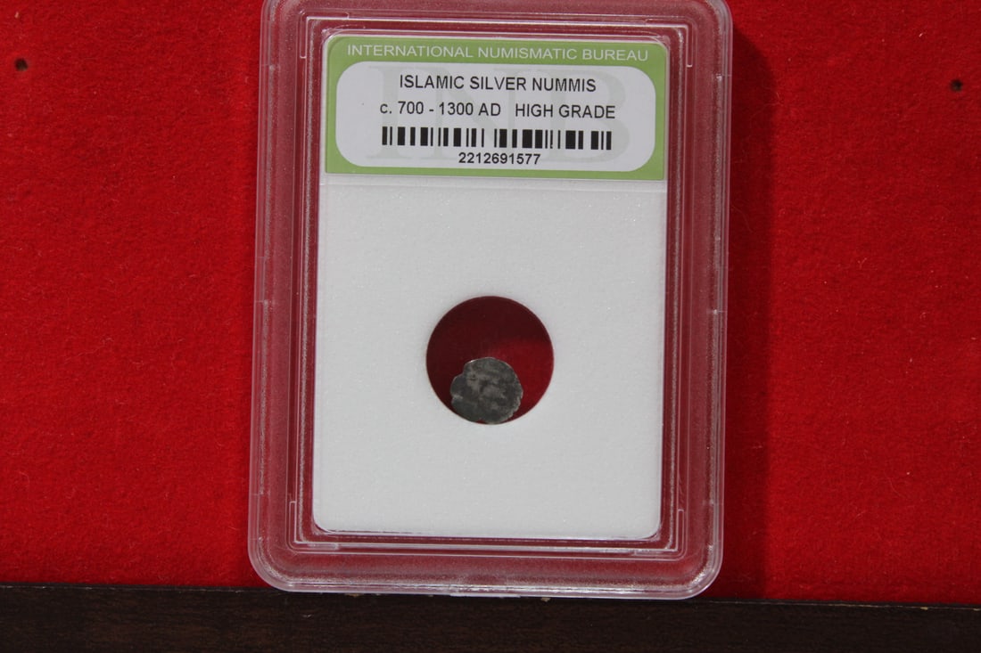 A Slabbed Islamic Silver Nummis: High Grade - c. 700 - 1300 A.D.