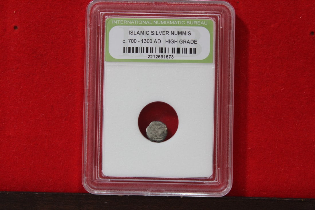 A Slabbed Islamic Silver Nummis: High Grade - c. 700 - 1300 A.D.