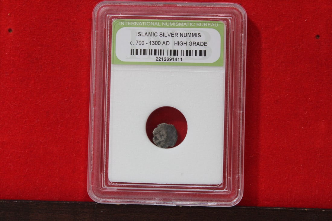 A Slabbed Islamic Silver Nummis: High Grade - c. 700 - 1300 A.D.