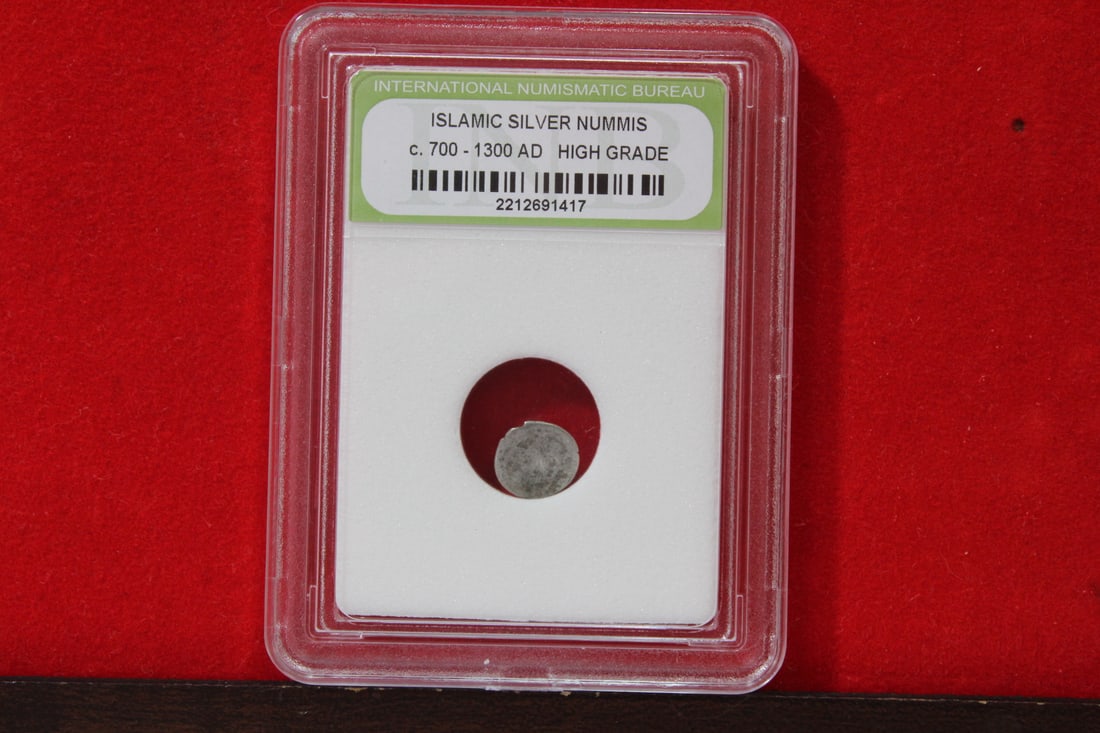 A Slabbed Islamic Silver Nummis: High Grade - c. 700 - 1300 A.D.
