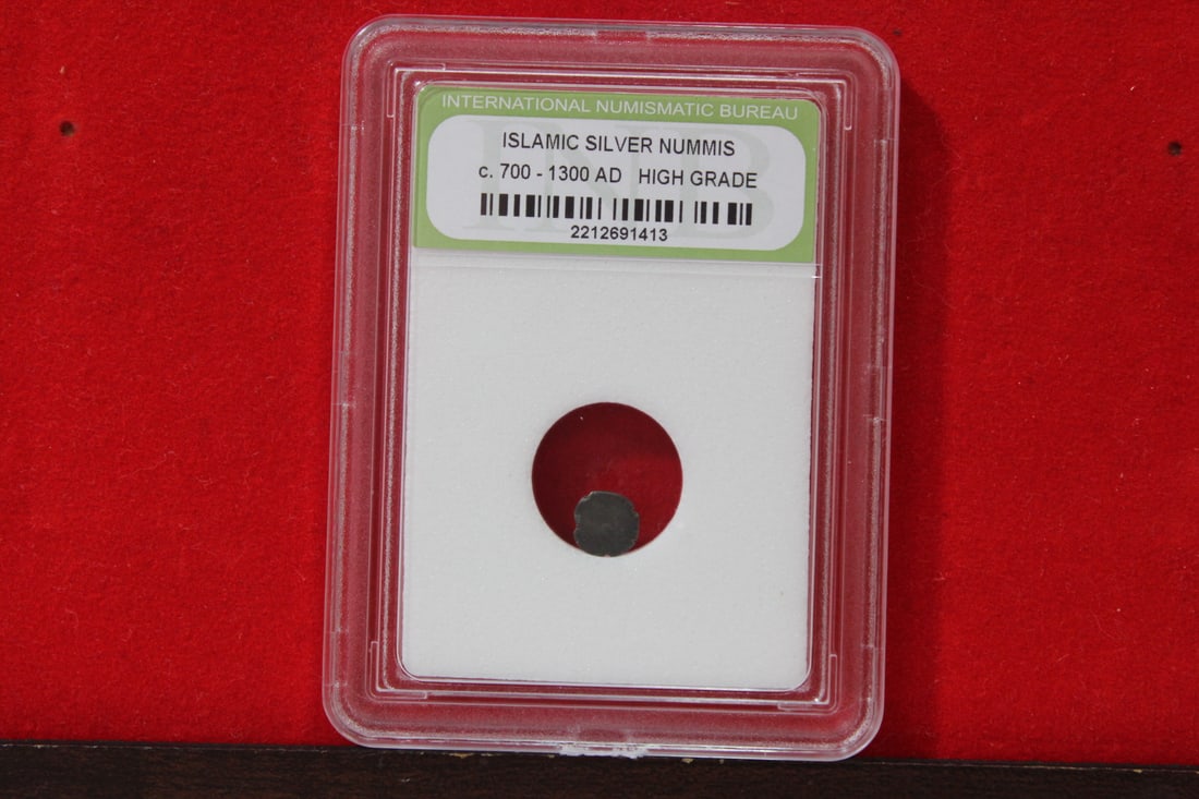 A Slabbed Islamic Silver Nummis: High Grade - c. 700 - 1300 A.D.