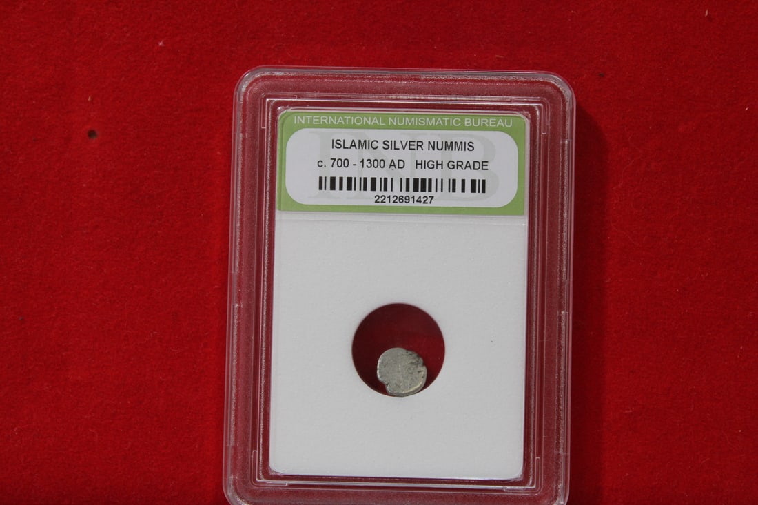 A Slabbed Islamic Silver Nummis: High Grade - c. 700 - 1300 A.D.