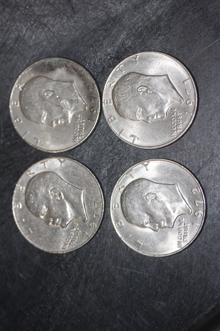 Lot of 4 Clad Ike Dollars: as shown