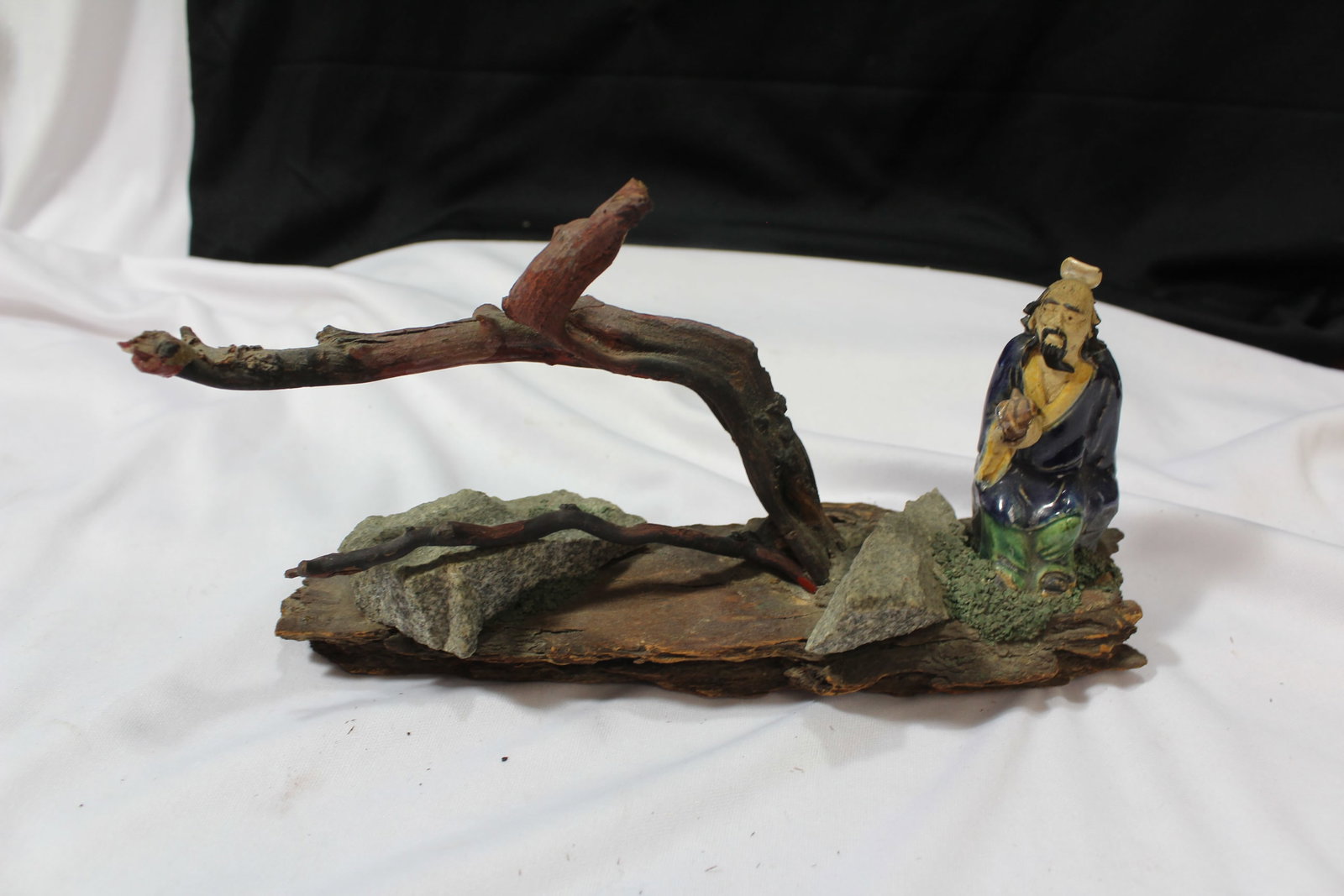 A Vintage Chinese Mud Man: 9 inches long - with a fallen branch