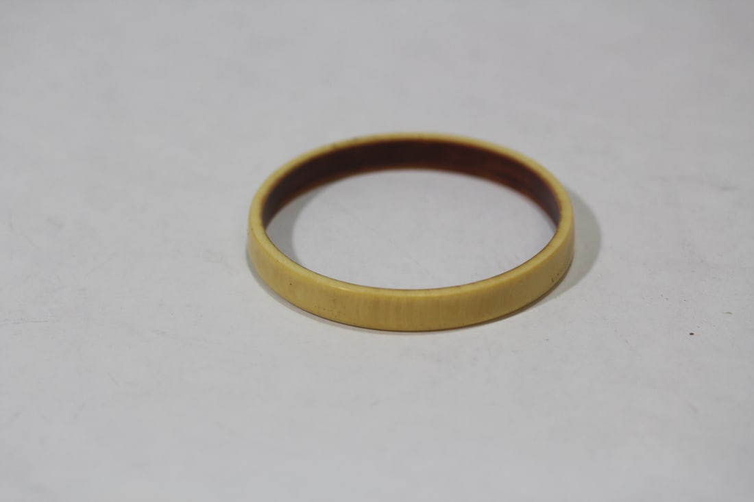 A Carved Bone Bangle Bracelet: 2 3/8" inside diameter