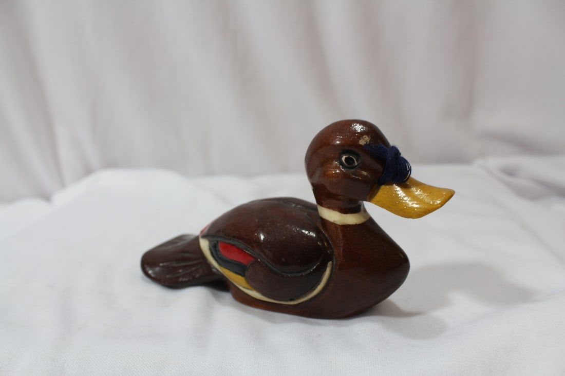An Oriental Wooden Duck: with Chinese stamp on the bottom - 5 inches long