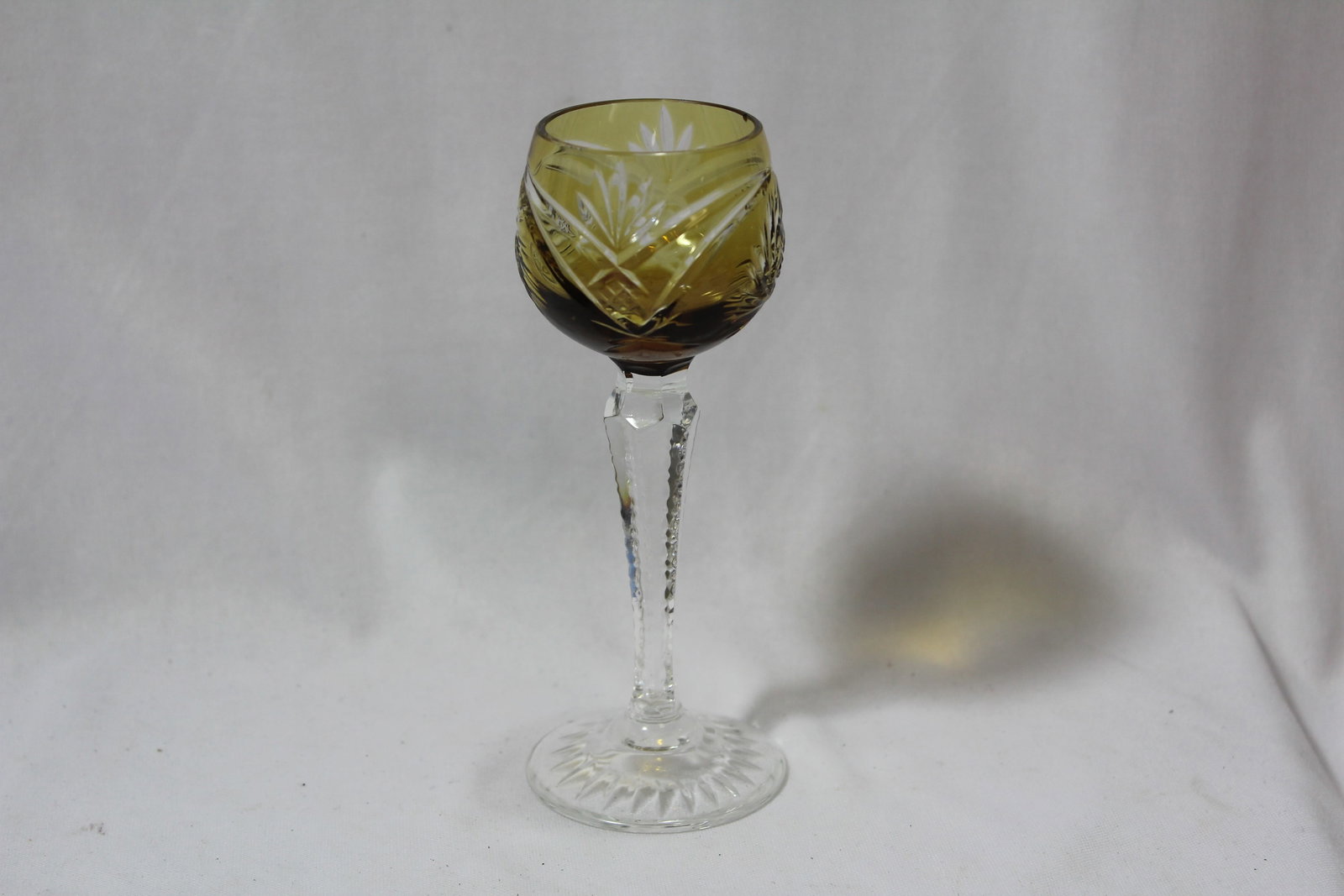 A Yellow Colour Glass Stem Cup: please note: small inside chip as shown - 5 5/8" tall