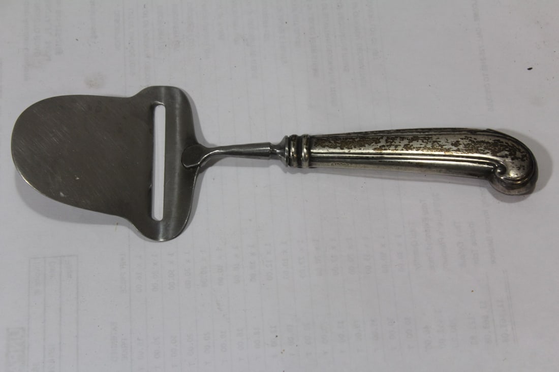 A Sterling Handle Peeler: 8 3/4" long - made in Germany