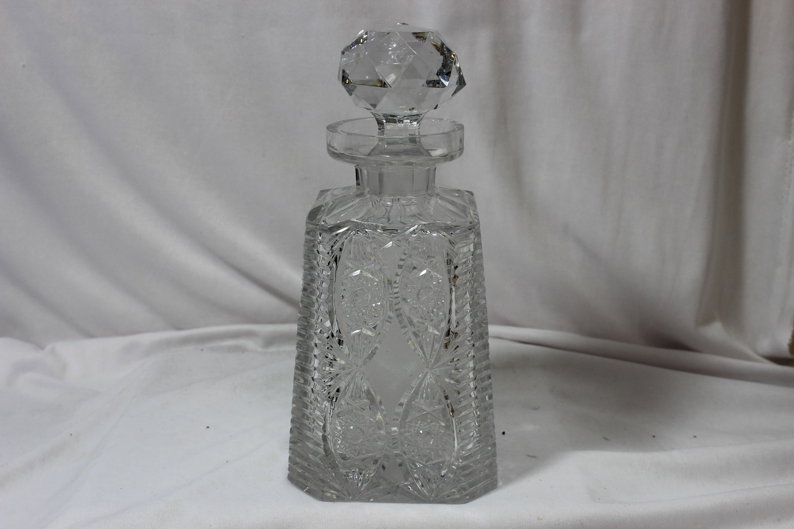 A Brilliant Cut Glass Decanter: signed: Clark - please note: chip underneath the stopper, not noticeable when closed - 9 5/8" tall