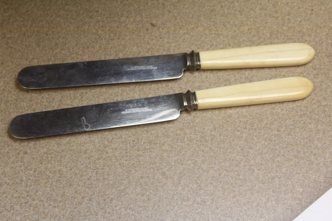 Pair of butter knifes: bone handle(?) 9 3/8" across - J. Russell & Company Green River Works