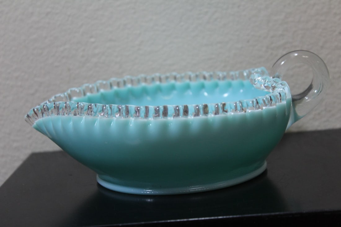 A Vintage Teal Glass Bowl: 8" across, including the handle