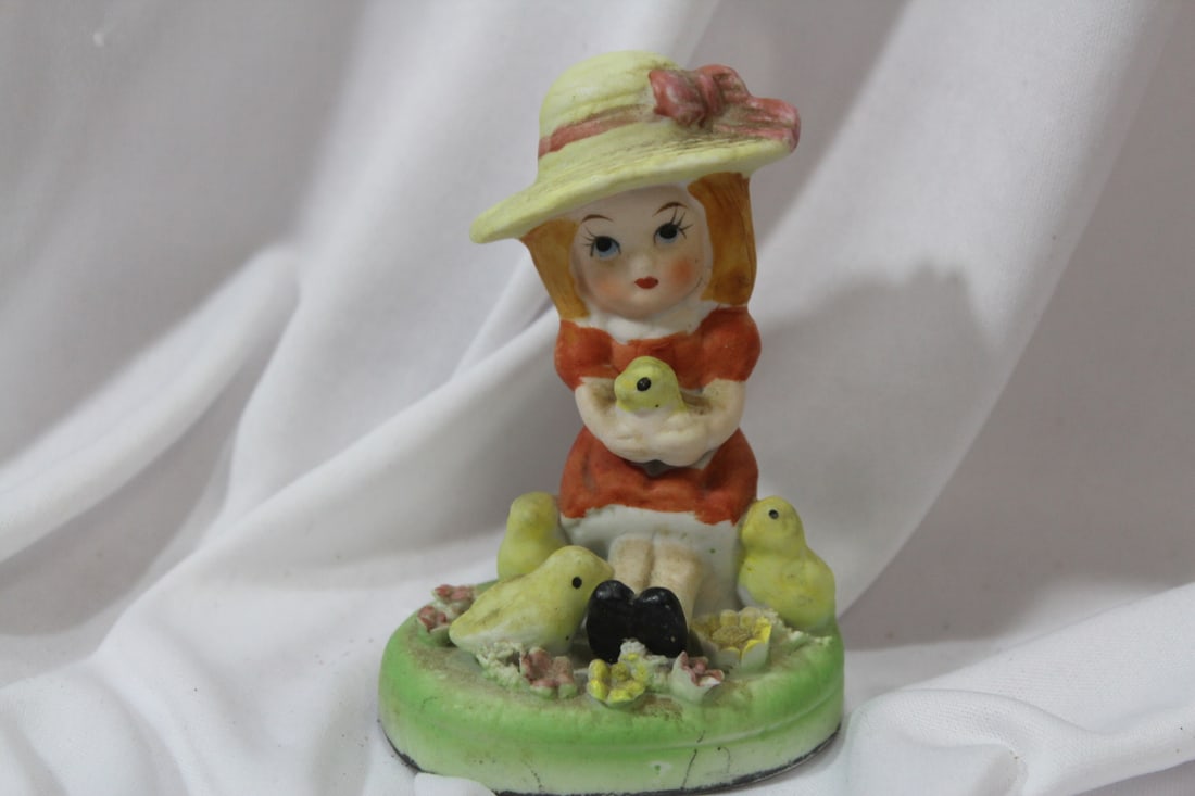 A Ceramic Girl Figurine: please note: manufacturer defects - 4 1/4" tall