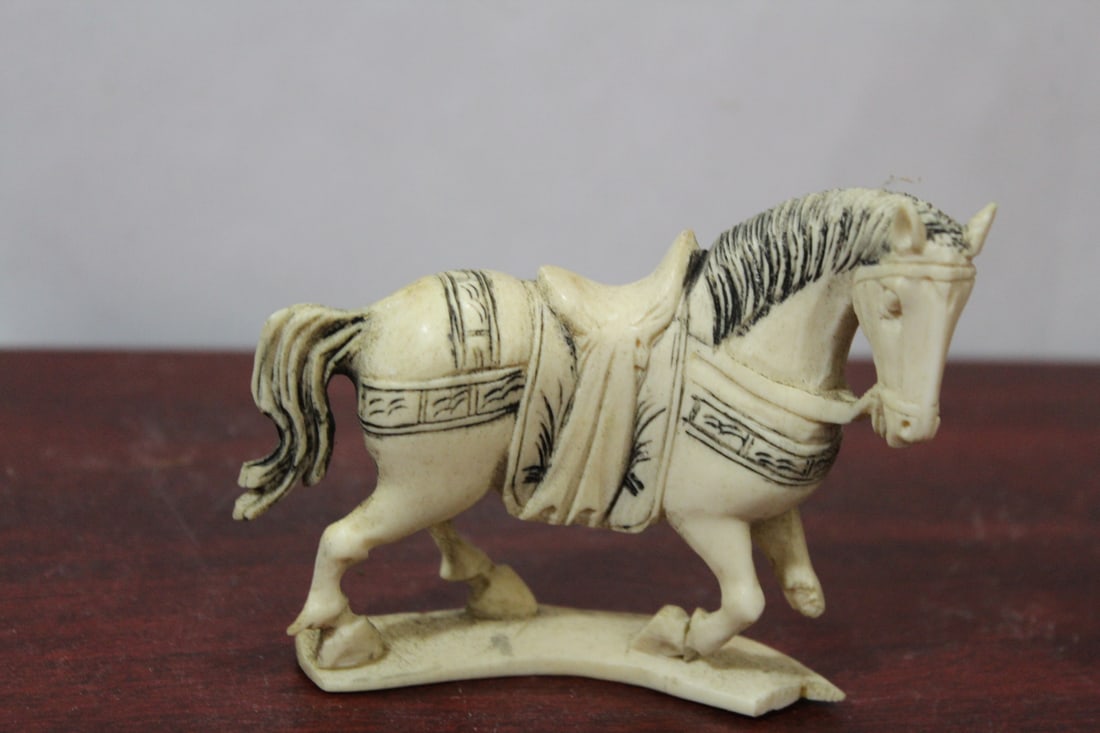 A Carved Bone Horse: vintage - please note: losses as shown - 4" across