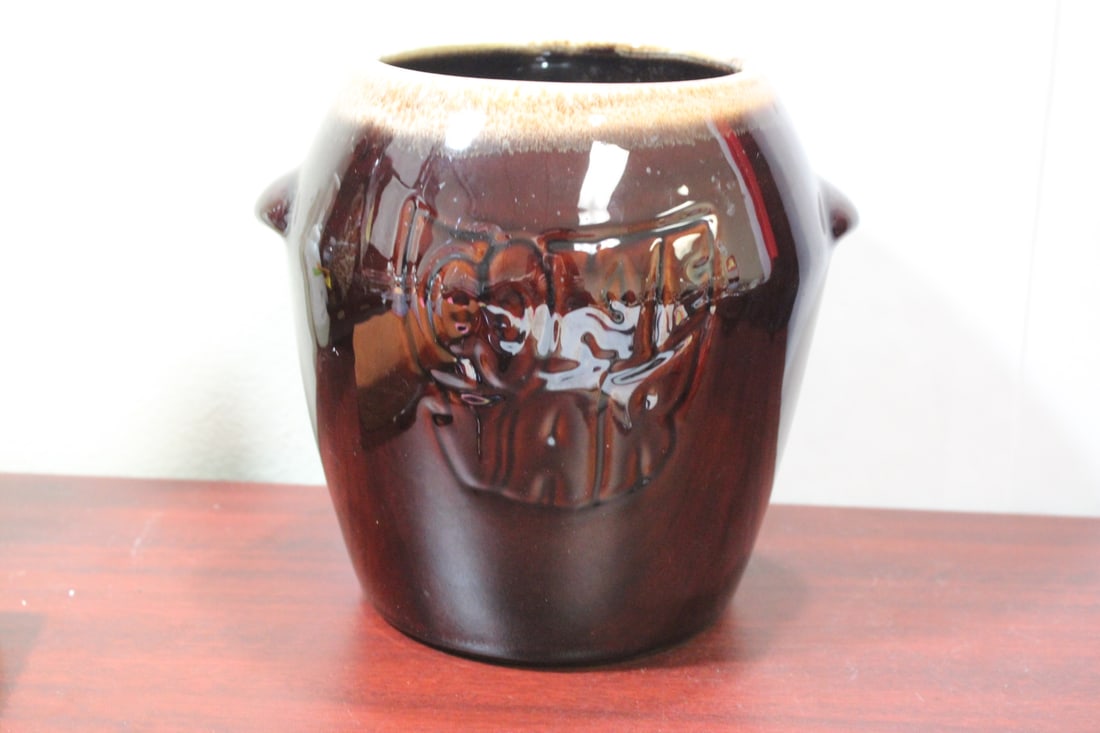 A Pottery Jar: please note: bottom chip as shown - 7 3/4" tall