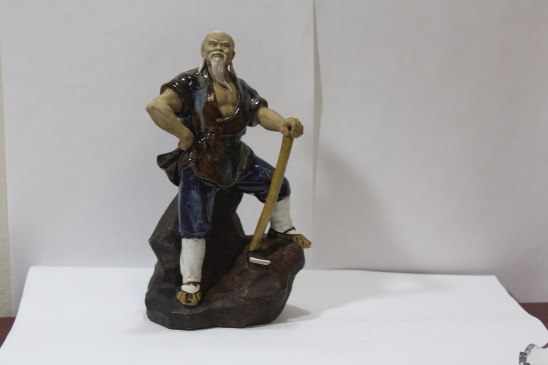 A Solid Pottery Chinese Mudman: 9 7/8" tall