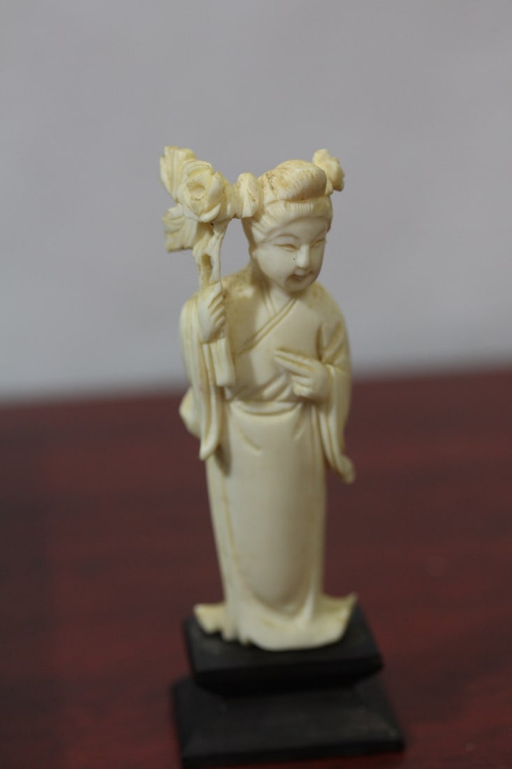 A Carved Bone Beauty on Stand: overall= 4" tall